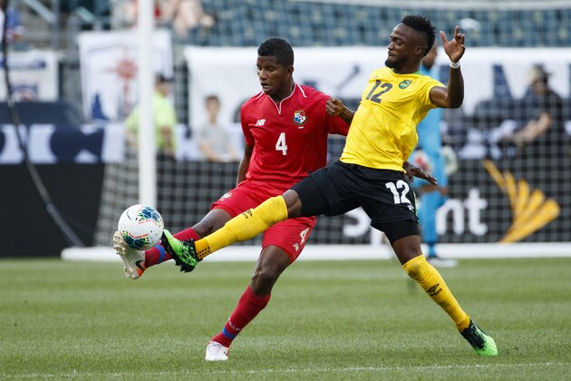 Panama's Fidel Escobar, left, and Jamaica's Junior Flemmings battle for the ball during the first half of a CONCACAF Gold Cup soccer match, Sunday, June 30, 2019, in Philadelphia. (AP Photo/Matt Slocum)