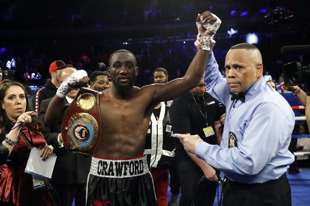Terence Crawford has his hand raised in victory after defeating Lithuania's Egidijus Kavaliauskas by TKO in the ninth round of a WBO welterweight boxing match, Saturday, Dec. 14, 2019, in New York. (AP Photo/Michael Owens) Terence Crawford has his hand raised in victory after defeating Lithuania's Egidijus Kavaliauskas by TKO in the ninth round of a WBO welterweight boxing match, Saturday, Dec. 14, 2019, in New York. (AP Photo/Michael Owens)
