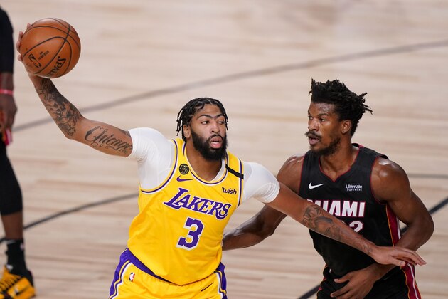 Los Angeles Lakers forward Anthony Davis passes around Miami Heat forward Jimmy Butler during the first half in Game 4 of basketball's NBA Finals Tuesday, Oct. 6, 2020, in Lake Buena Vista, Fla. (AP Photo/Mark J. Terrill) Los Angeles Lakers forward Anthony Davis passes around Miami Heat forward Jimmy Butler during the first half in Game 4 of basketball's NBA Finals Tuesday, Oct. 6, 2020, in Lake Buena Vista, Fla. (AP Photo/Mark J. Terrill)