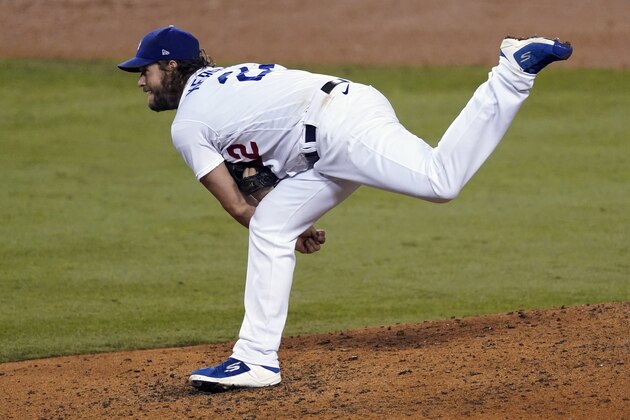 Los Angeles Dodgers starting pitcher Clayton Kershaw follows through on a delivery during the sixth inning in Game 2 of the team's National League wild-card baseball series against the Milwaukee Brewers on Thursday, Oct. 1, 2020, in Los Angeles. (AP Photo/Ashley Landis)