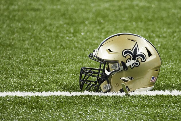 New Orleans Saints helmets on the field against the Detroit Lions during an NFL football game in Detroit, Sunday, Oct. 4, 2020. (AP Images/Rick Osentoski)