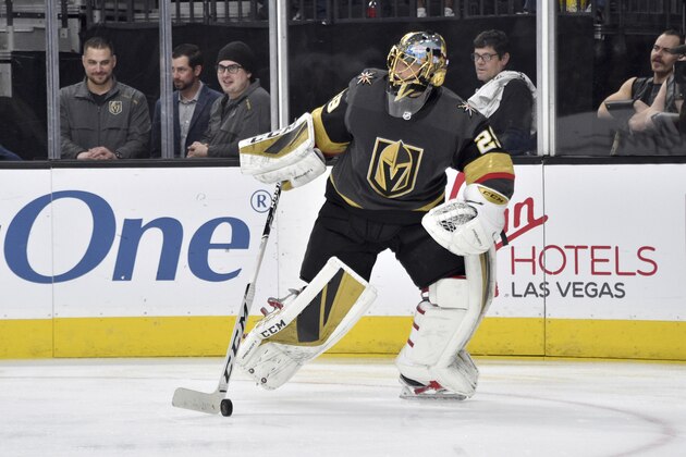 Vegas Golden Knights goaltender Marc-Andre Fleury (29) skates with the puck against the Carolina Hurricanes during the third period of an NHL hockey game Saturday, Feb. 8, 2020, in Las Vegas. (AP Photo/David Becker)