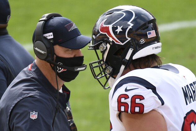 Houston Texans head coach Bill O'Brien, left, talks with center Nick Martin (66) on the sideline during the first half of an NFL football game, Sunday, Sept. 27, 2020, in Pittsburgh. (AP Photo/Don Wright)