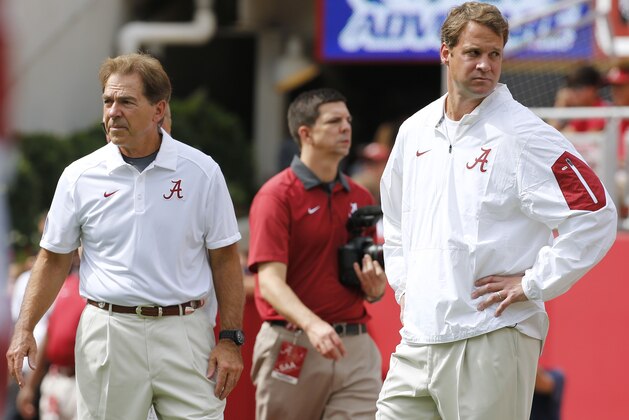 Alabama head coach Nick Saban, left, and offensive coordinator Lane Kiffin stand next to each other before an NCAA college football game against Louisiana Monroe in Tuscaloosa, Ala., Saturday, Sept. 26, 2015. (AP Photo/Jonathan Bachman)