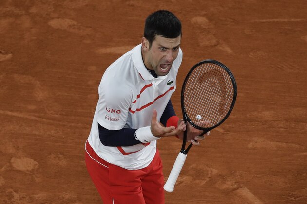 Serbia's Novak Djokovic vents his anger after failing to break the first service game of Spain's Pablo Carreno Busta in the fourth set of the quarterfinal match of the French Open tennis tournament at the Roland Garros stadium in Paris, France, Wednesday, Oct. 7, 2020. (AP Photo/Alessandra Tarantino)