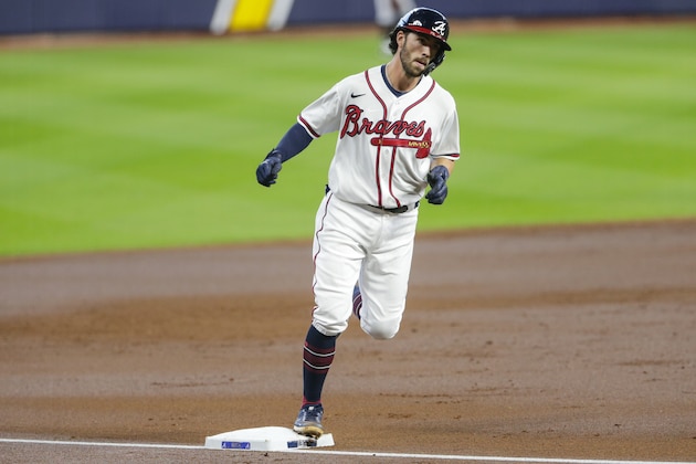 Atlanta Braves' Dansby Swanson runs the bases after hitting a home run during the second inning in Game 2 of a baseball National League Division Series against the Miami Marlins Wednesday, Oct. 7, 2020, in Houston. (AP Photo/Michael Wyke)