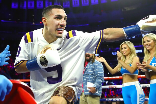 FILE - In this Jan. 19, 2019, file photo, Manny Pacquiao, center right, fights Adrien Broner in a WBA welterweight title boxing match in Las Vegas. A spokesman for Pacquiao says the famed fighter's Los Angeles home was robbed at about the time he was in the ring with rival Adrien Broner in Las Vegas. Spokesman Mike Quinn confirmed the burglary to NBC News. Los Angeles police said a burglary was reported about 4:15 p.m. Sunday, Jan. 20, 2019. in the Larchmont neighborhood. (AP Photo/John Locher, File)