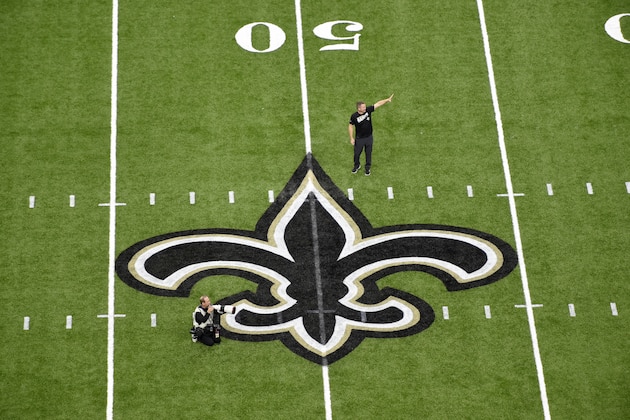The New Orleans Saints logo is seen on the field before an NFL preseason football game in New Orleans, Thursday, Aug. 29, 2019. (AP Photo/Bill Feig) The New Orleans Saints logo is seen on the field before an NFL preseason football game in New Orleans, Thursday, Aug. 29, 2019. (AP Photo/Bill Feig)