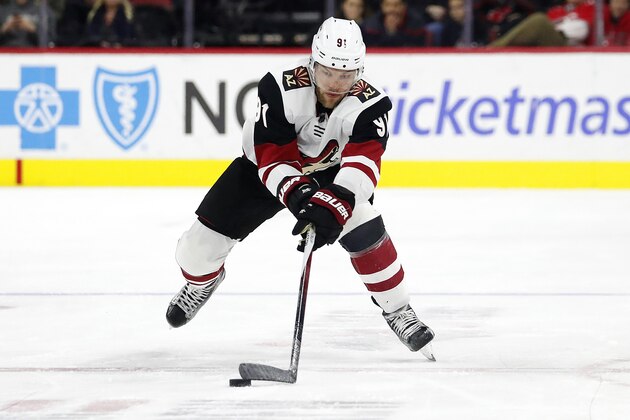 Arizona Coyotes' Taylor Hall (91) moves the puck against the Carolina Hurricanes during the second period of an NHL hockey game in Raleigh, N.C., Friday, Jan. 10, 2020. (AP Photo/Karl B DeBlaker)