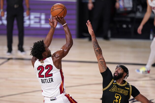 Miami Heat's Jimmy Butler (22) takes a shot over Anthony Davis (3) during the first half of Game 2 of basketball's NBA Finals, Friday, Oct. 2, 2020, in Lake Buena Vista, Fla. (AP Photo/Mark J. Terrill)