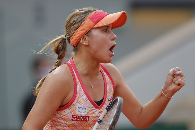 Sofia Kenin of the U.S. clenches her fist after scoring a point against Petra Kvitova of the Czech Republic in the semifinal match of the French Open tennis tournament at the Roland Garros stadium in Paris, France, Thursday, Oct. 8, 2020. (AP Photo/Michel Euler)