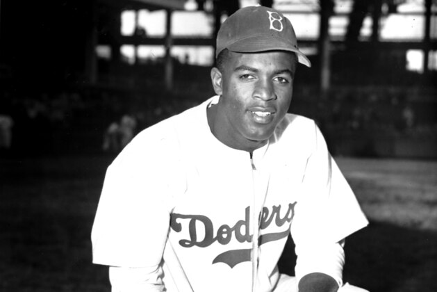 FILE - In this April 11, 1947 file photo, Jackie Robinson of the Brooklyn Dodgers poses at Ebbets Field in the Brooklyn borough of New York. Robinson is the subject of a two-part documentary, FILE - In this April 11, 1947 file photo, Jackie Robinson of the Brooklyn Dodgers poses at Ebbets Field in the Brooklyn borough of New York. Robinson is the subject of a two-part documentary,