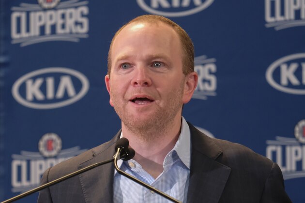 From left, Los Angeles Clippers President of Basketball Operations Lawrence Frank introduces Paul George and Kawhi Leonard at a press conference at the Green Meadows Recreation Center in Los Angeles, Wednesday, July 23, 2019. (AP Photo/Ringo H.W. Chiu)