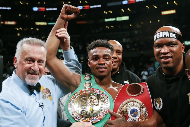 FILE - IN this Sept. 28, 2019, file photo, Errol Spence Jr., center, celebrates his victory over Shawn Porter during the WBC & IBF World Welterweight Championship boxing match in Los Angeles. Authorities say welterweight boxing champion Spence was seriously injured but is expected to survive after crashing his Ferrari in Dallas. Dallas police say the crash happened just before 3 a.m. Thursday, Oct. 10, 2019, when Spence's Ferrari crossed the median into oncoming traffic and flipped over several times. (AP Photo/Ringo H.W. Chiu, File) FILE - IN this Sept. 28, 2019, file photo, Errol Spence Jr., center, celebrates his victory over Shawn Porter during the WBC & IBF World Welterweight Championship boxing match in Los Angeles. Authorities say welterweight boxing champion Spence was seriously injured but is expected to survive after crashing his Ferrari in Dallas. Dallas police say the crash happened just before 3 a.m. Thursday, Oct. 10, 2019, when Spence's Ferrari crossed the median into oncoming traffic and flipped over several times. (AP Photo/Ringo H.W. Chiu, File)