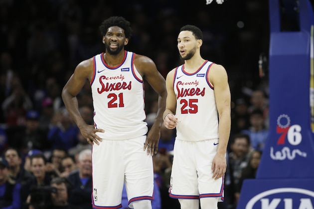 Philadelphia 76ers' Ben Simmons, right, and Joel Embiid talk during an NBA basketball game against the New Orleans Pelicans, Friday, Dec. 13, 2019, in Philadelphia. (AP Photo/Matt Slocum)