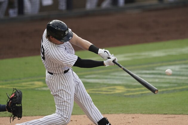 New York Yankees' Luke Voit hits a solo home run against the Tampa Bay Rays during the second inning in Game 4 of a baseball American League Division Series Thursday, Oct. 8, 2020, in San Diego. (AP Photo/Jae C. Hong)