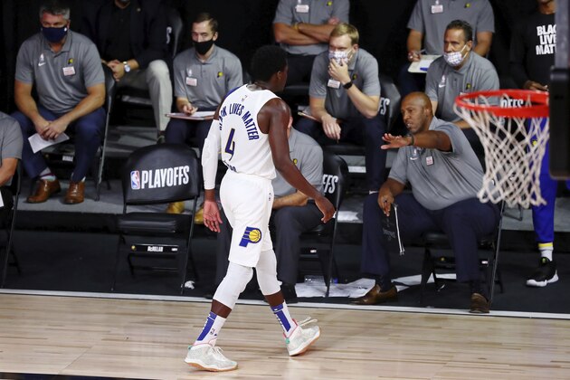 Indiana Pacers guard Victor Oladipo (4) walks off the court after fouling out against the Miami Heat during the second half of Game 3 of an NBA basketball first-round playoff series, Saturday, Aug. 22, 2020, in Lake Buena Vista, Fla. (Kim Klement/Pool Photo via AP)