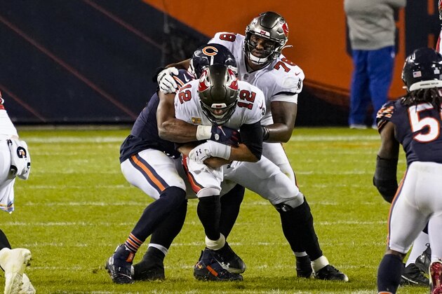 Tampa Bay Buccaneers quarterback Tom Brady (12) is sacked by Chicago Bears outside linebacker Khalil Mack (52) during the second half of an NFL football game in Chicago, Thursday, Oct. 8, 2020. (AP Photo/Nam Y. Huh) Tampa Bay Buccaneers quarterback Tom Brady (12) is sacked by Chicago Bears outside linebacker Khalil Mack (52) during the second half of an NFL football game in Chicago, Thursday, Oct. 8, 2020. (AP Photo/Nam Y. Huh)