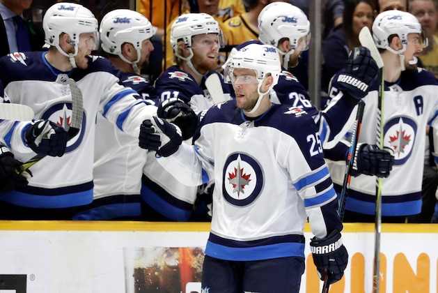 Winnipeg Jets center Paul Stastny (25) is congratulated after scoring a goal against the Winnipeg Jets during the second period in Game 1 of an NHL hockey second-round playoff series Friday, April 27, 2018, in Nashville, Tenn. (AP Photo/Mark Humphrey)
