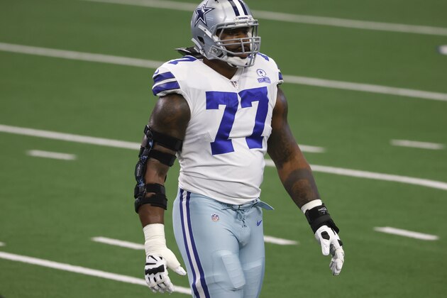 Dallas Cowboys offensive tackle Tyron Smith (77) stands on the field for warmups before an NFL football game against the Cleveland Browns in Arlington, Texas, Sunday, Oct. 4, 2020. (AP Photo/Ron Jenkins)