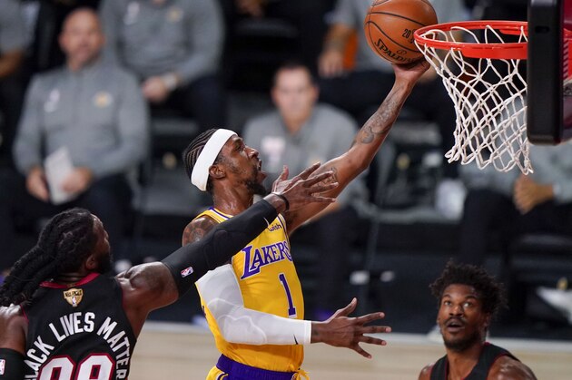 Los Angeles Lakers guard Kentavious Caldwell-Pope shoot around Miami Heat forward Jae Crowder during the first half in Game 4 of basketball's NBA Finals Tuesday, Oct. 6, 2020, in Lake Buena Vista, Fla. (AP Photo/Mark J. Terrill)