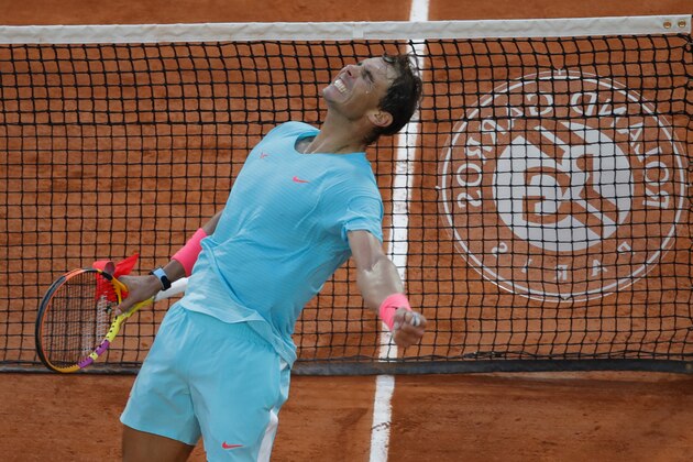 Spain's Rafael Nadal celebrates winning the semifinal match of the French Open tennis tournament against Argentina's Diego Schwartzman in three sets, 6-3, 6-3, 7-6, at the Roland Garros stadium in Paris, France, Friday, Oct. 9, 2020. (AP Photo/Christophe Ena)