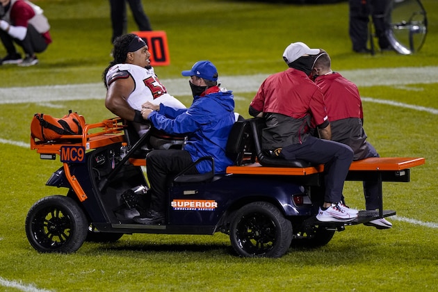 Tampa Bay Buccaneers nose tackle Vita Vea (50) is driven off the field after being injured in the second half of an NFL football game against the Chicago Bears in Chicago, Thursday, Oct. 8, 2020. (AP Photo/Nam Y. Huh)