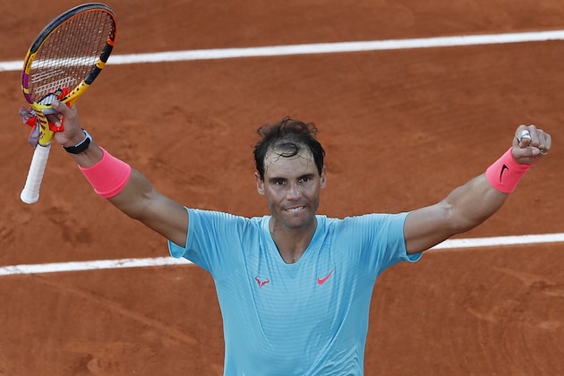 Spain's Rafael Nadal celebrates winning the semifinal match of the French Open tennis tournament against Argentina's Diego Schwartzman in three sets, 6-3, 6-3, 7-6, at the Roland Garros stadium in Paris, France, Friday, Oct. 9, 2020. (AP Photo/Alessandra Tarantino)
