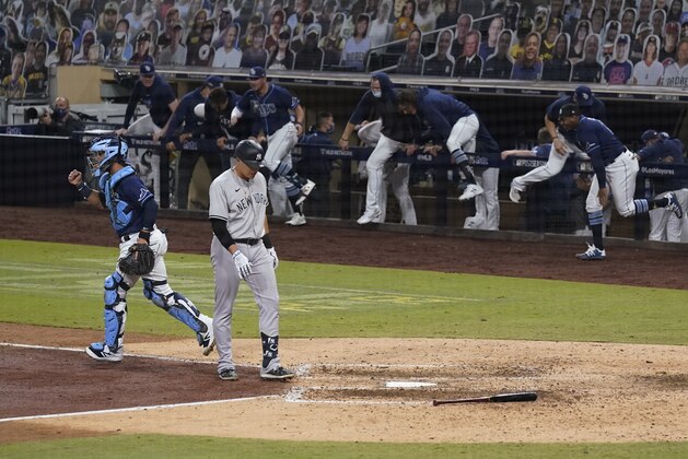 Tampa Bay Rays catcher Michael Perez, left, celebrates after New York Yankees' Gio Urshela flied out for the final out in Game 5 of a baseball AL Division Series, Friday, Oct. 9, 2020, in San Diego. Tampa Bay won 2-1 to advance to the AL Championship Series. (AP Photo/Gregory Bull) Tampa Bay Rays catcher Michael Perez, left, celebrates after New York Yankees' Gio Urshela flied out for the final out in Game 5 of a baseball AL Division Series, Friday, Oct. 9, 2020, in San Diego. Tampa Bay won 2-1 to advance to the AL Championship Series. (AP Photo/Gregory Bull)