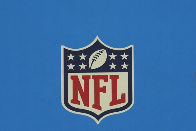 The NFL Shield / logo is seen on a blue background before an NFL football game between the Minnesota Vikings and the Houston Texans, Sunday, Oct. 4, 2020, in Houston. (AP Photo/Matt Patterson)