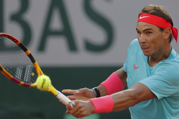 Spain's Rafael Nadal plays a shot against Argentina's Diego Schwartzman in the semifinal match of the French Open tennis tournament at the Roland Garros stadium in Paris, France, Friday, Oct. 9, 2020. (AP Photo/Michel Euler)