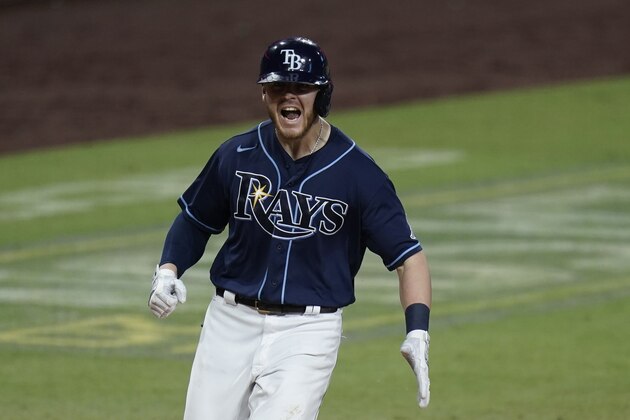 Tampa Bay Rays' Michael Brosseau celebrates after hitting a solo home run during the eighth inning in Game 5 of a baseball AL Division Series against the New York Yankees, Friday, Oct. 9, 2020, in San Diego. (AP Photo/Jae C. Hong)