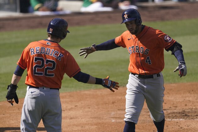 Houston Astros' George Springer (4) celebrates after hitting a two-run home run that scored Josh Reddick (22) during the third inning of Game 2 of a baseball American League Division Series against the Oakland Athletics in Los Angeles, Tuesday, Oct. 6, 2020. (AP Photo/Ashley Landis) Houston Astros' George Springer (4) celebrates after hitting a two-run home run that scored Josh Reddick (22) during the third inning of Game 2 of a baseball American League Division Series against the Oakland Athletics in Los Angeles, Tuesday, Oct. 6, 2020. (AP Photo/Ashley Landis)