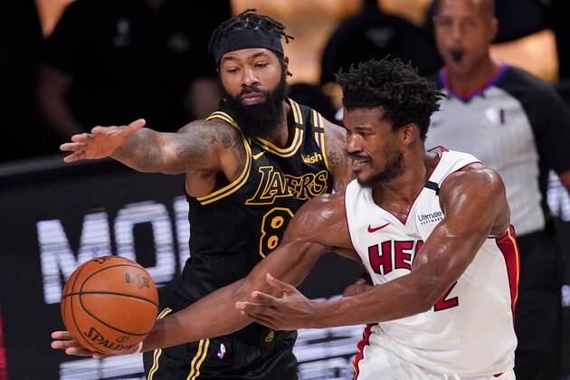 Los Angeles Lakers forward Markieff Morris vies for a rebound with Miami Heat forward Jimmy Butler during the second half in Game 5 of basketball's NBA Finals Friday, Oct. 9, 2020, in Lake Buena Vista, Fla. (AP Photo/Mark J. Terrill) Los Angeles Lakers forward Markieff Morris vies for a rebound with Miami Heat forward Jimmy Butler during the second half in Game 5 of basketball's NBA Finals Friday, Oct. 9, 2020, in Lake Buena Vista, Fla. (AP Photo/Mark J. Terrill)
