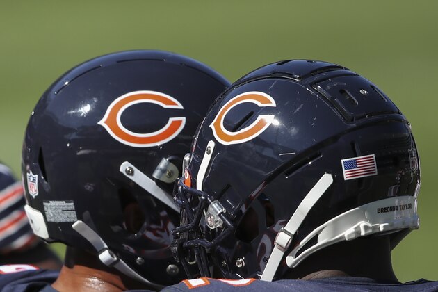 Chicago Bears players in their helmets during the second half of an NFL football game against the New York Giants, Sunday, Sept. 20, 2020, in Chicago. (AP Photo/Kamil Krzaczynski)