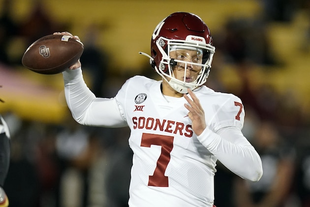 FILE - In this Saturday, Oct. 3, 2020, file photo, Oklahoma quarterback Spencer Rattler throws a pass during the first half an NCAA college football game against Iowa State, in Ames, Iowa. No. 22 Texas vs. Oklahoma, at Cotton Bowl Stadium, Dallas. There is no State Fair of Texas this year because of the pandemic and both teams are coming off a loss, but this is still the Red River rivalry.  (AP Photo/Charlie Neibergall, File)
