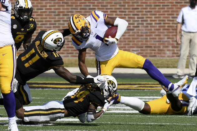 LSU wide receiver Kayshon Boutte (1) runs with the ball as Missouri linebacker Devin Nicholson (11) and defensive back Adam Sparks (14) defend during the first half of an NCAA college football game Saturday, Oct. 10, 2020, in Columbia, Mo. (AP Photo/L.G. Patterson) LSU wide receiver Kayshon Boutte (1) runs with the ball as Missouri linebacker Devin Nicholson (11) and defensive back Adam Sparks (14) defend during the first half of an NCAA college football game Saturday, Oct. 10, 2020, in Columbia, Mo. (AP Photo/L.G. Patterson)