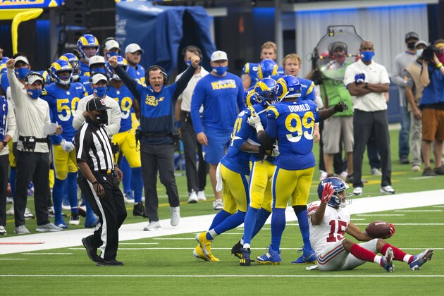 Los Angeles Rams team react after cornerback Jalen Ramsey (20)'s tackle on New York Giants wide receiver Golden Tate (15) during an NFL football game, Sunday, Oct. 4, 2020, in Inglewood, Calif. (AP Photo/Kyusung Gong) Los Angeles Rams team react after cornerback Jalen Ramsey (20)'s tackle on New York Giants wide receiver Golden Tate (15) during an NFL football game, Sunday, Oct. 4, 2020, in Inglewood, Calif. (AP Photo/Kyusung Gong)