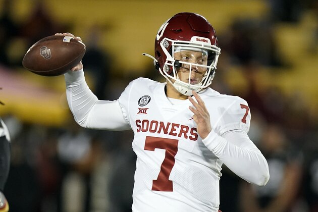 FILE - In this Saturday, Oct. 3, 2020, file photo, Oklahoma quarterback Spencer Rattler throws a pass during the first half an NCAA college football game against Iowa State, in Ames, Iowa. No. 22 Texas vs. Oklahoma, at Cotton Bowl Stadium, Dallas. There is no State Fair of Texas this year because of the pandemic and both teams are coming off a loss, but this is still the Red River rivalry.  (AP Photo/Charlie Neibergall, File)