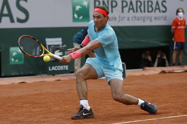 Spain's Rafael Nadal plays a shot against Argentina's Diego Schwartzman in the semifinal match of the French Open tennis tournament at the Roland Garros stadium in Paris, France, Friday, Oct. 9, 2020. (AP Photo/Michel Euler)