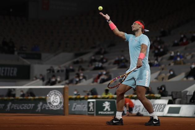 Spain's Rafael Nadal plays a shot against Italy's Jannik Sinner in the quarterfinal match of the French Open tennis tournament at the Roland Garros stadium in Paris, France, Tuesday, Oct. 6, 2020. (AP Photo/Alessandra Tarantino)