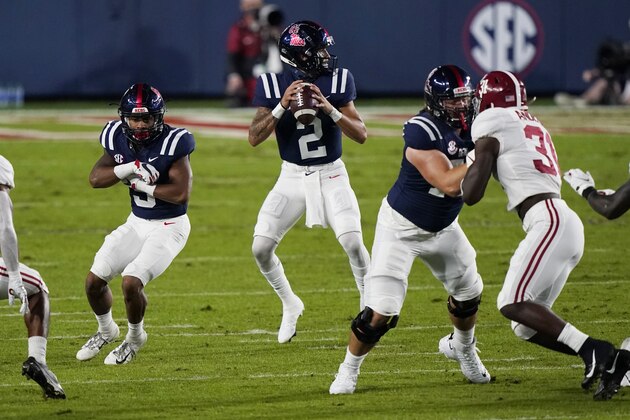 Mississippi quarterback Matt Corral (2) drops back to pass against during the first half of the team's NCAA college football game against Alabama in Oxford, Miss., Saturday, Oct. 10, 2020. (AP Photo/Rogelio V. Solis)