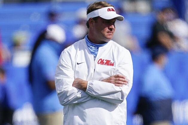Mississippi head coach Lane Kiffin watches his team warm up before an NCAA college football game against Kentucky, Saturday, Oct. 3, 2020, in Lexington, Ky. (AP Photo/Bryan Woolston)