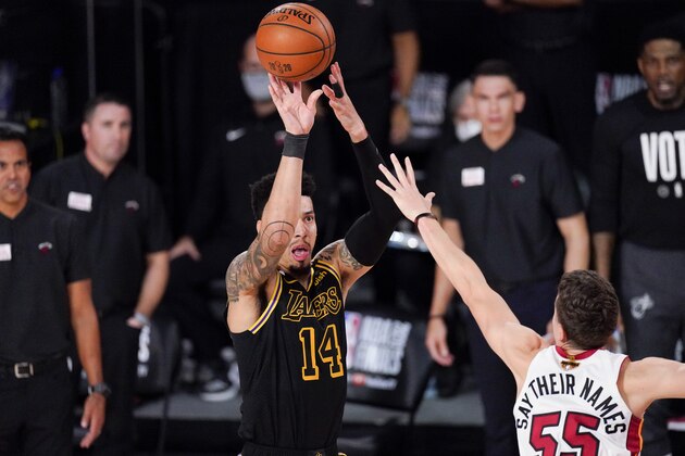 Los Angeles Lakers guard Danny Green shoots over Miami Heat guard Duncan Robinson during the second half in Game 5 of basketball's NBA Finals Friday, Oct. 9, 2020, in Lake Buena Vista, Fla. (AP Photo/Mark J. Terrill)