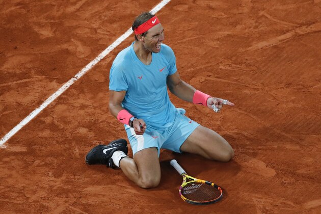 Spain's Rafael Nadal celebrates winning the final match of the French Open tennis tournament against Serbia's Novak Djokovic in three sets, 6-0, 6-2, 7-5, at the Roland Garros stadium in Paris, France, Sunday, Oct. 11, 2020. (AP Photo/Christophe Ena)