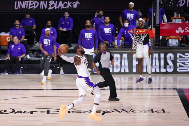 Los Angeles Lakers' LeBron James (23) goes up for a dunk during the first half in Game 6 of basketball's NBA Finals against the Miami Heat Sunday, Oct. 11, 2020, in Lake Buena Vista, Fla. (AP Photo/Mark J. Terrill)