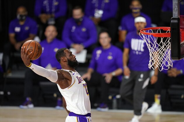 Los Angeles Lakers' LeBron James (23) dunks during the first half in Game 6 of basketball's NBA Finals against the Miami Heat Sunday, Oct. 11, 2020, in Lake Buena Vista, Fla. (AP Photo/Mark J. Terrill)