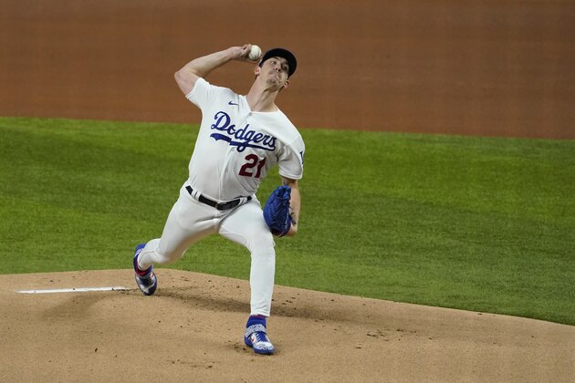 Los Angeles Dodgers starting pitcher Walker Buehler (21) throws against the San Diego Padres during the first inning in Game 1 of a baseball NL Division Series, Tuesday, Oct. 6, 2020, in Arlington, Texas. (AP Photo/Tony Gutierrez)