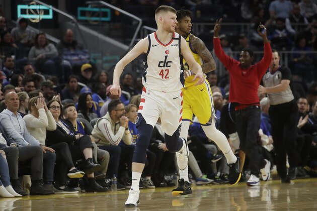 Washington Wizards forward Davis Bertans (42) reacts after shooting a 3-point basket against the Golden State Warriors during the second half of an NBA basketball game in San Francisco, Sunday, March 1, 2020. (AP Photo/Jeff Chiu)