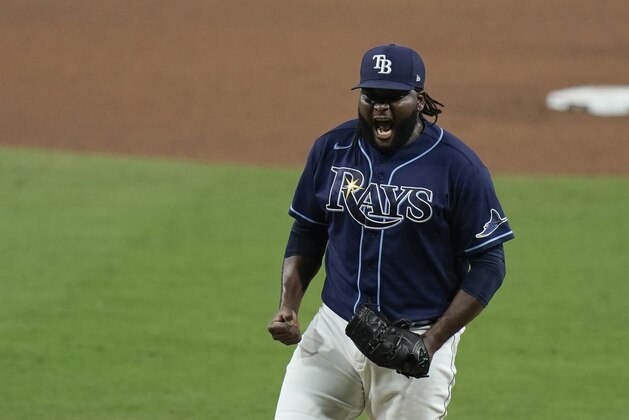 Tampa Bay Rays' Diego Castillo celebrates following Game 5 of the baseball team's AL Division Series against the New York Yankees, Friday, Oct. 9, 2020, in San Diego. The Rays won 2-1 to advance to the AL Championship Series. (AP Photo/Jae C. Hong)